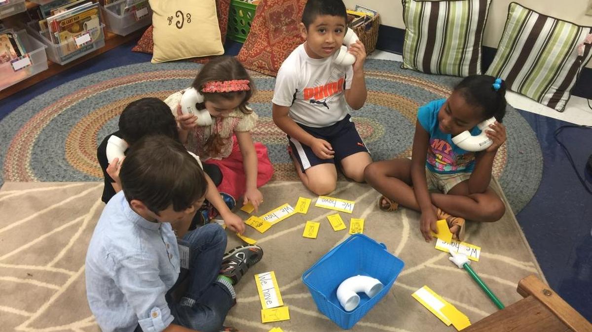Lansdowne Elementary School students, left to right: Abdelsalam ElGehawe, Albaraa AlThini, Hanin AlThini, Henry Munoz Moreno and Yiseidi Beltre work on language lessons.