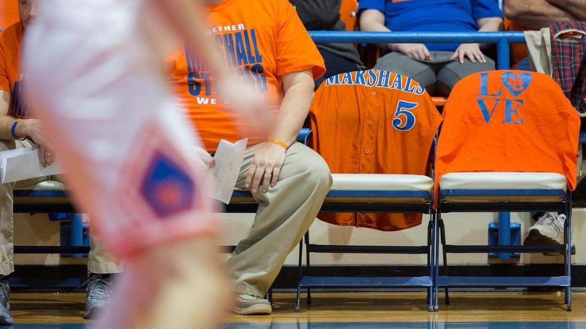 Two chairs on Marshall County High School’s bench were kept empty during a basketball game Monday in memory of the victims of a Jan. 23 fatal shooting at the school in Benton. One chair was draped with Preston Ryan Cope’s baseball jersey, and the other had a shirt that said “Be like Bailey” on the back, in memory of Bailey Nicole Holt.