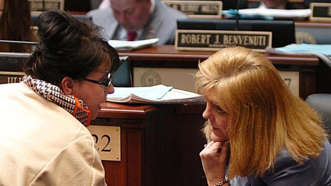 Rep. Regina Huff -R Williamsburg (left) speaks to Rep. Jill York - R,-Grayson on the Kentucky House of Representatives floor. Wednesday March 15, 2017.