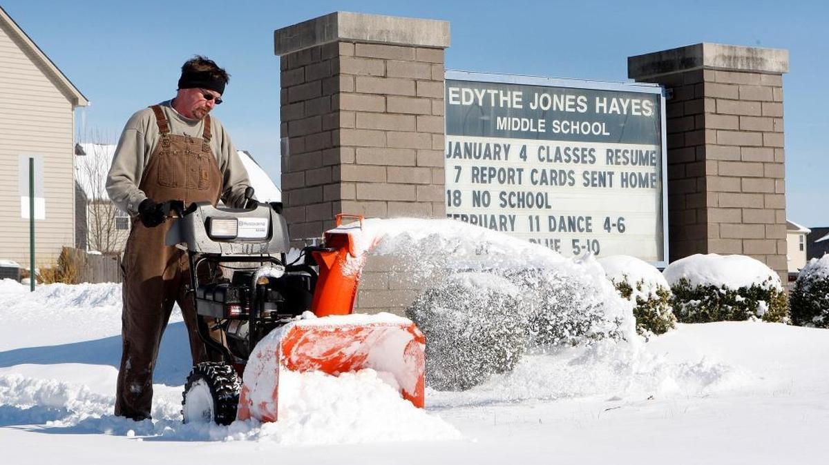 Fayette County schools employee Shaun Powers cleared sidewalks outside Edythe J. Hayes Middle School on Jan. 24.
