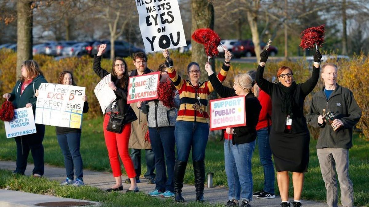 Some Paul Laurence Dunbar High School teachers and staff members held signs in 2018 in front of the school on Man o’ War Boulevard to protest education spending.