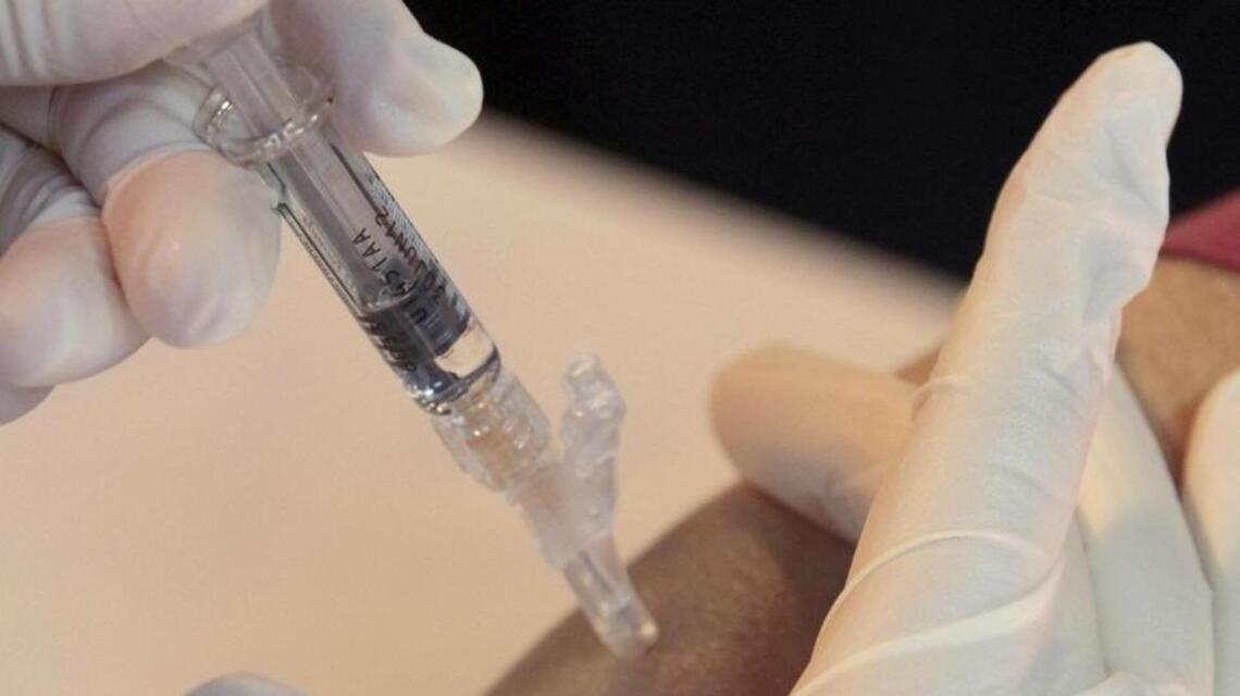 A Kentucky child has died of flu. Officials urge vaccination as cases rise.