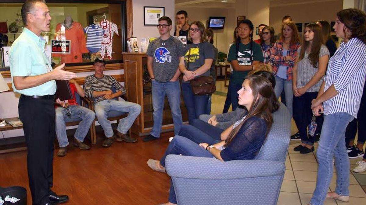 Dan Yates, left, James B. Haggin Memorial Hospital public relations and marketing director, talked to Mercer County and Burgin Schools seniors about careers in the medical profession. More than 150 seniors toured the facility. Hospital staff told the students what each department does and discussed educational requirements and potential salaries in the medical field.