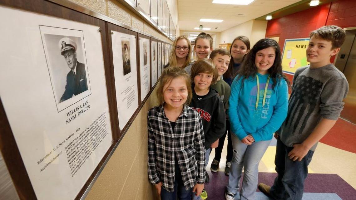 Students in Denise Humphries’ class posed by the “Hall of Fame” plaque honoring Willis Lee at Maurice Bowling Middle School in Owenton, Ky., Wednesday, December 14, 2016. Owen County 7th-graders in Denise Humphries’ class are working on projects to honor native son Willis Lee, who won the most Olympics medals of any Kentuckian. In the 1920 Summer Olympic Games in Antwerp, Belgium, Lee, who died in 1945, personally won five gold medals, one silver and one bronze as a member of the American Rifle Team. Front row L-R: Taylor Arnce,Isaac Cockrell, Brooklyn Morris, Preston Cunningham. Back row-Sydney Cobb, Alexandria Perry, Charlie Baumann, Casey Tackett,