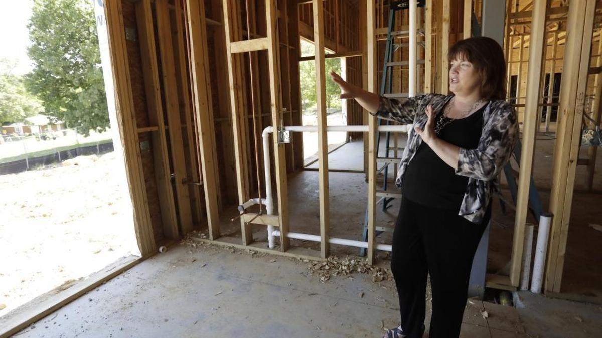 Vicki Jozefowicz, Kentucky River Foothills Development Council director, showed where large windows will go in the daycare at the future site of Eastern Scholar House in Richmond, Ky, on June 2, 2017. The program for single-parent college students provides housing, childcare and support services.