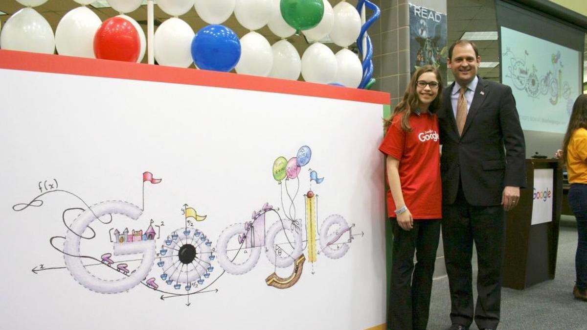 Maggie Cook-Allen, left, a junior at Paul Laurence Dunbar High School, and U.S. Rep. Andy Barr with Cook-Allen's winning Google “doodle” Friday morning. She was chosen at the Kentucky winner in the Doddle 4 Google national competition. The doodle is entitled “Calculus Amusement Park,” depicting her love for both mathematics and art.