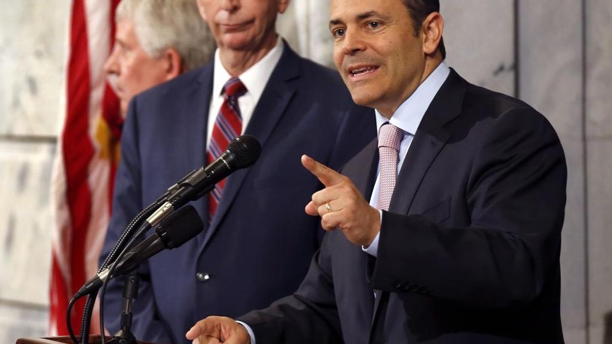 Gov. Matt Bevin, right, unveiled details of his plan to overhaul Medicaid during a morning news conference in the State Capitol rotunda in Frankfort, Ky., Wednesday, June 22, 2016. On the left is Mark D. Birdwhistell, a former Secretary of the Cabinet for Health and Family Services, who assembled a team of experts to assist in the drafting of a Medicaid waiver.