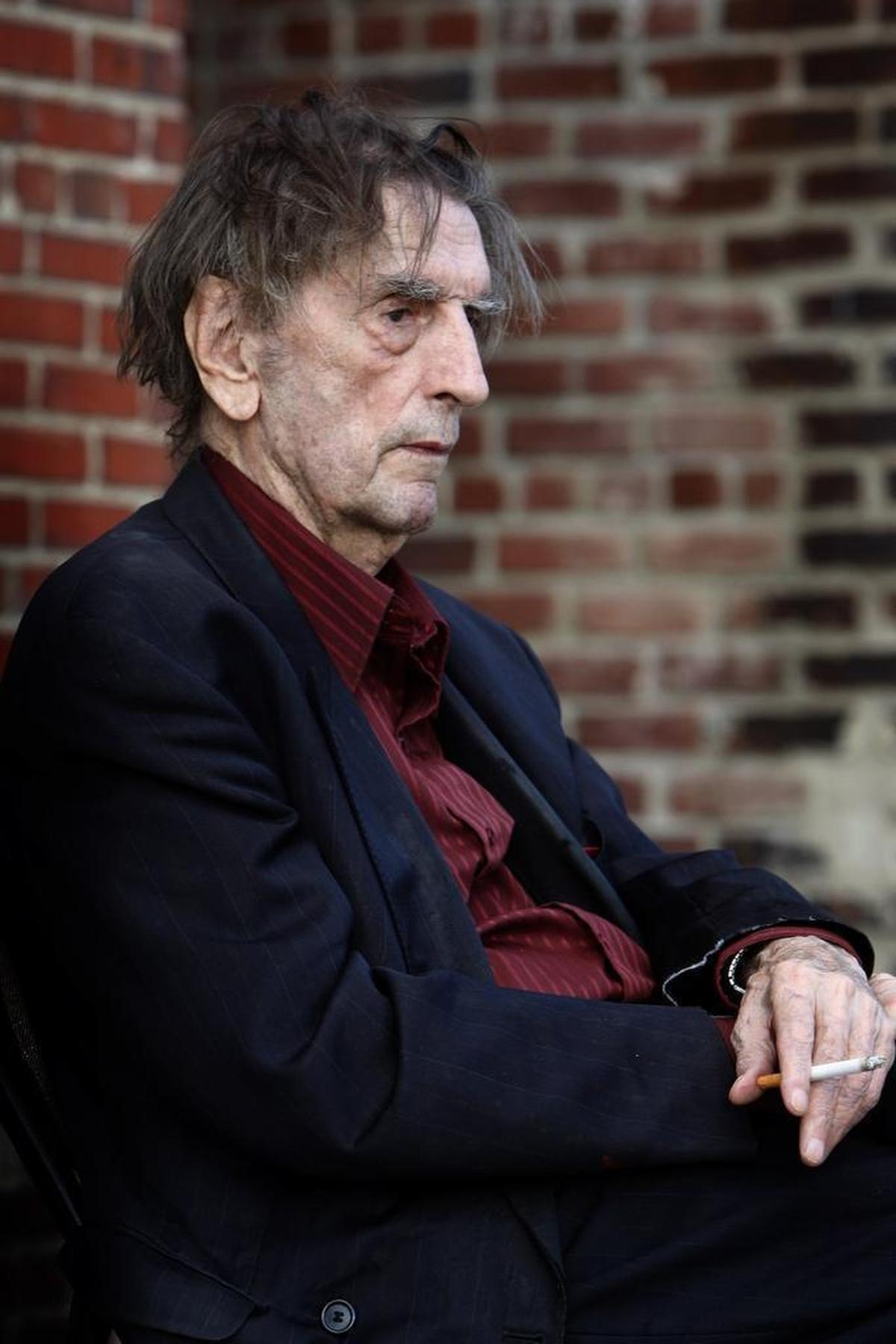 Harry Dean Stanton has a cigarette prior to a screening of “Dillinger” at the Kentucky Theatre in Lexington, Ky., June 15, 2014. Photo by Matt Goins