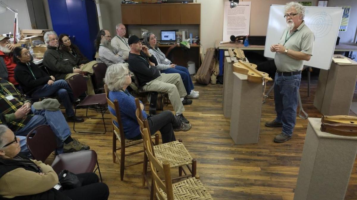 Dan Naselroad, master luthier at the Hindman School of Luthiery, speaks to a group of participants in the Hindman Dulcimer Homecoming on Nov. 11. The school is part of the Appalachian Artisan Center, which trains people in regional arts and crafts to give them job skills and boost the region’s economy.