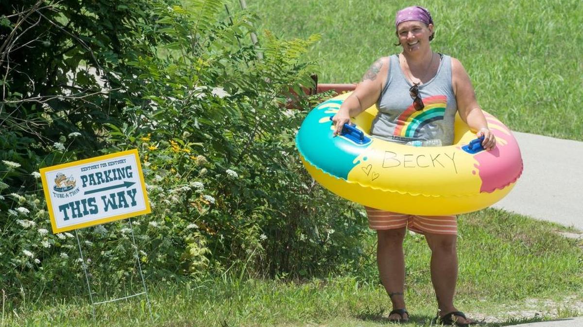 Becky Critchfield, of Lexington, volunteers to help tubers find their way to the water at Kentucky For Kentucky's Totally Tubular Tube-a-Thon on Elkhorn Creek on Saturday, July 30th, 2016 in Frankfort, Ky.