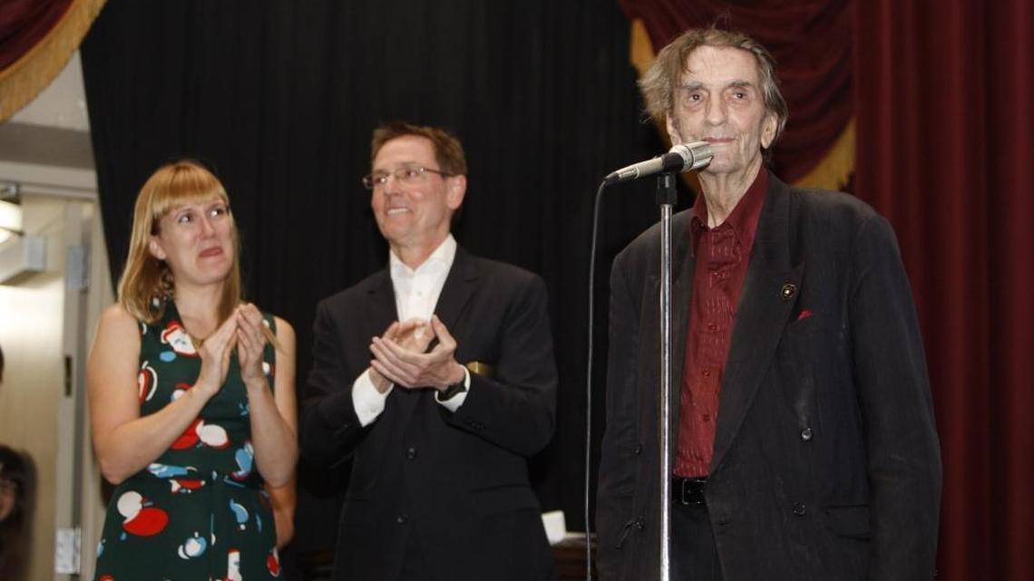 Harry Dean Stanton enjoys the moment as the audience gives him a standing ovation as organizer Lucy Jones, left, and Mayor Jim Gray look on prior to a screening of "Dillinger" at the Kentucky Theatre in Lexington, Ky., June 15, 2014. Photo by Matt Goins