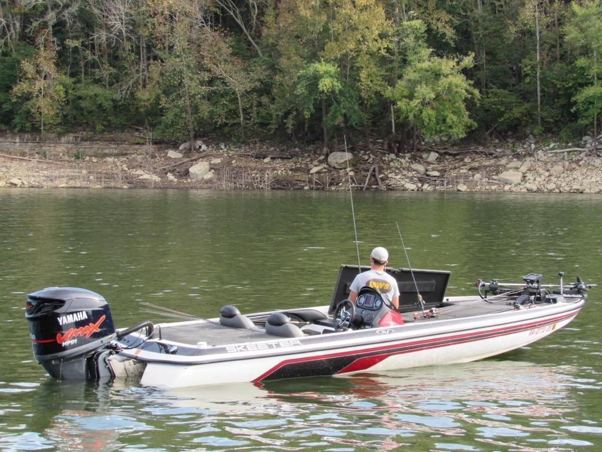 A fisherman stowed gear after participating in a fishing tournament on Lake Cumberland.