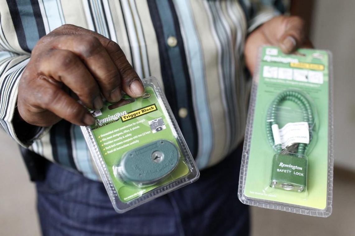 Luther Brown Jr. of Louisville showed two types of gun safety locks available through his gun safety program.