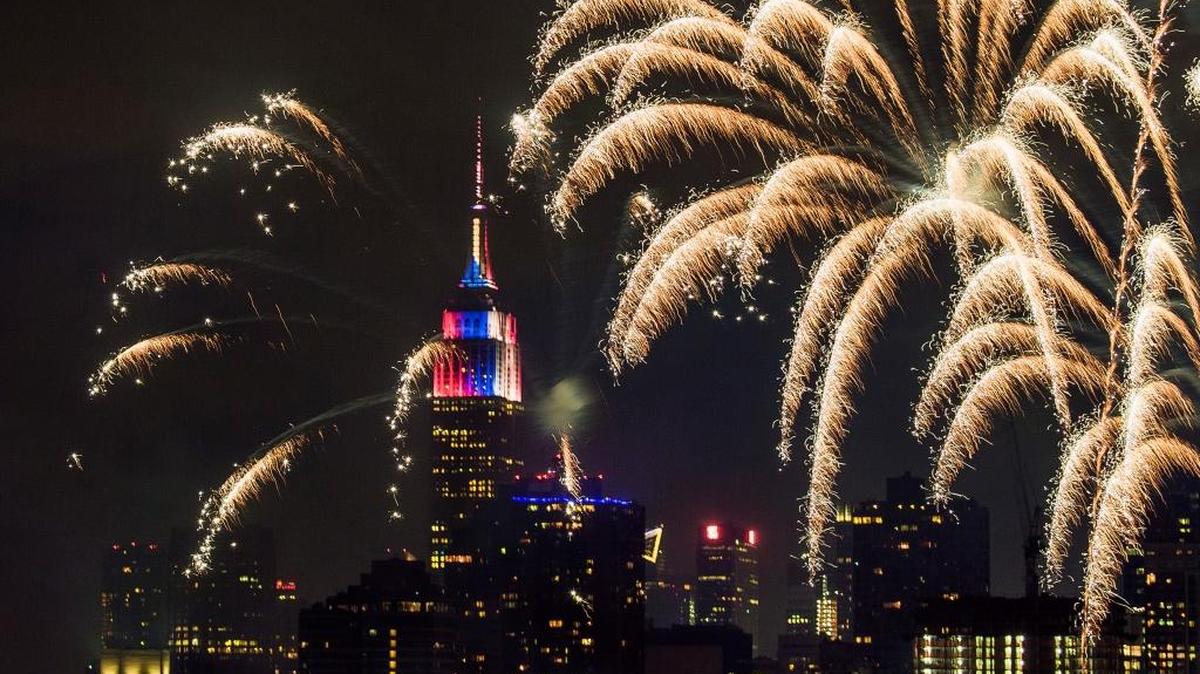 With the Empire State Building and New York City’s Manhattan skyline in the background, fireworks exploded during an Independence Day show over the East River in the 2017 celebration.