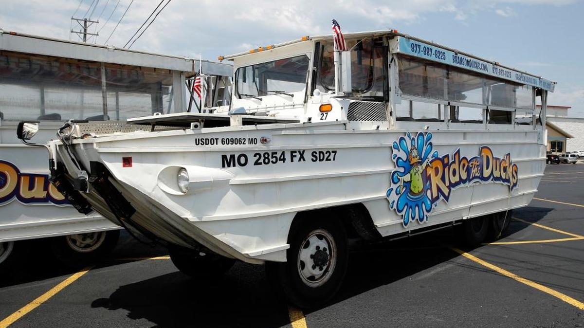 A duck boat sits idle in the parking lot of Ride the Ducks, an amphibious tour operator in Branson, Mo. Friday, July 20, 2018. The amphibious vehicle is similar to one of the company’s boats that capsized the day before on Table Rock Lake resulting in 17 deaths. (AP Photo/Charlie Riedel)