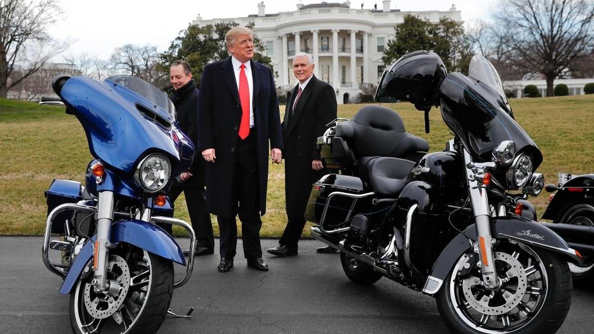 In February 2017, President Donald Trump, Vice President Mike Pence, right, and White House Chief of Staff Reince Priebus, left, walked among Harley-Davidson motorcycles on the South Lawn of the White House in Washington.
