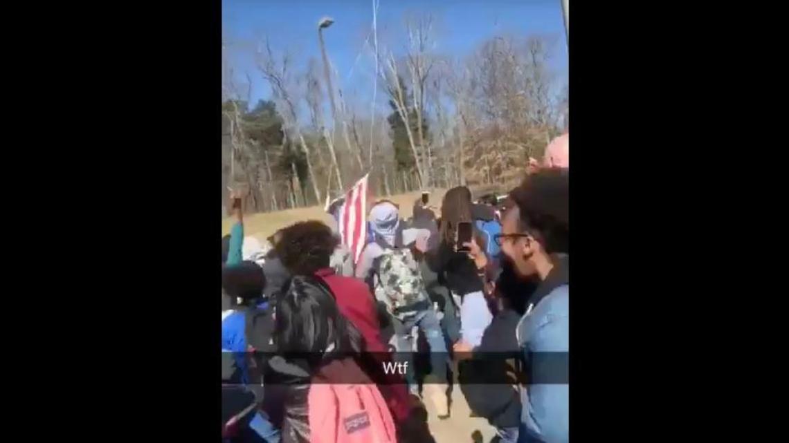 Nashville police say students jumped on a police car and tore down a flag during a walkout at Antioch High School.