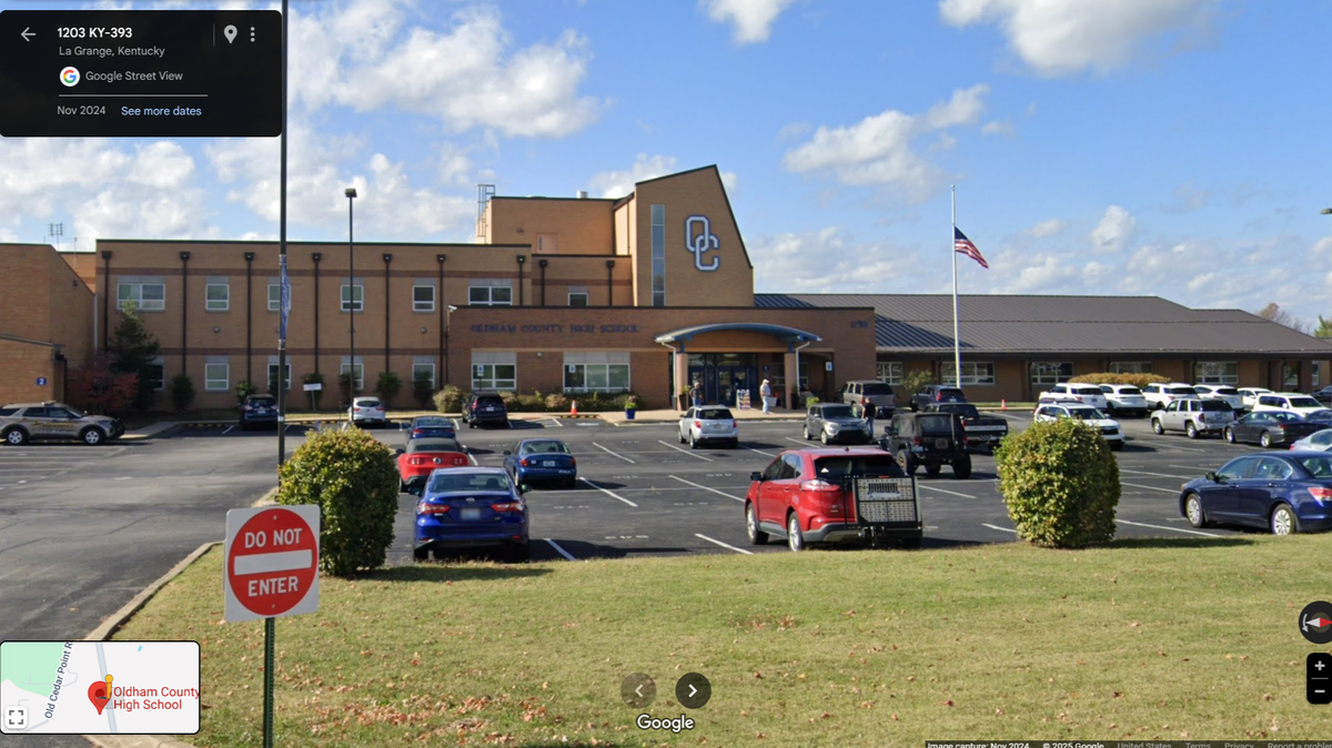 The teacher is also accused of throwing a ball at the heads of two students, authorities said.