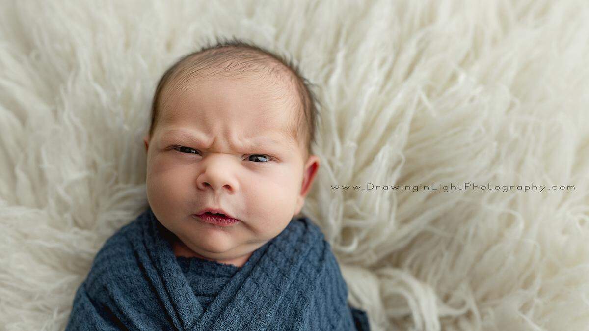 A photoshoot of a newborn baby in Ohio has the internet buzzing because of his “grumpy” expressions.
