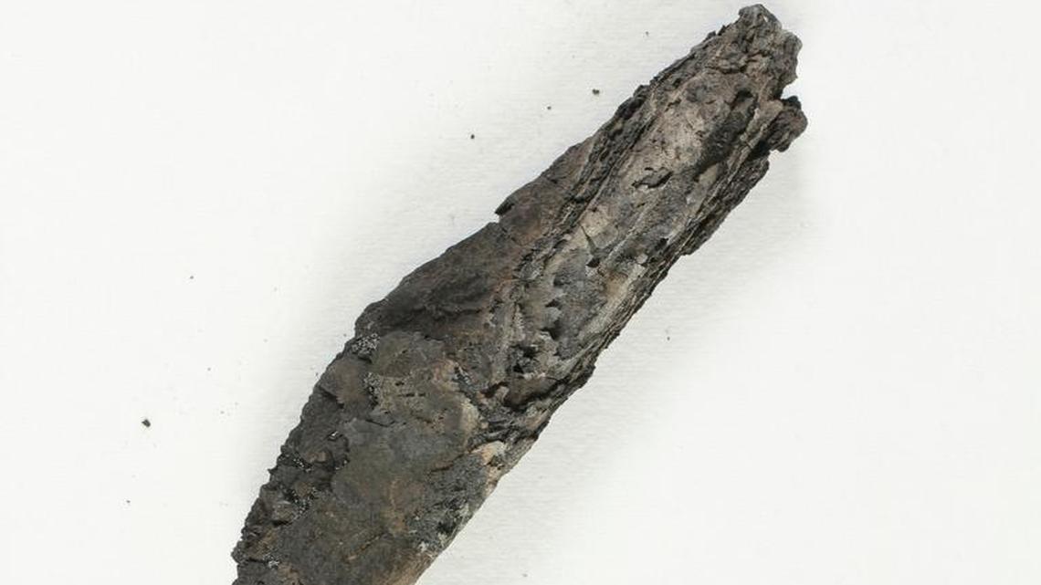 This undated photo released by the Israel Antiquities Authority shows an ancient charred scroll destroyed in a fire centuries ago. The 3D analysis is the first time experts say they have been able to read the text of an ancient scroll without having to physically open it.