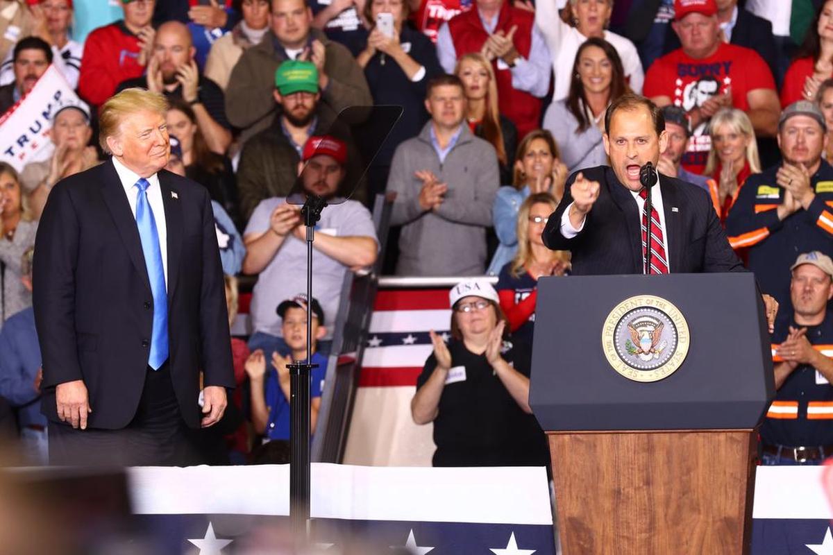 Congressman Andy Barr joins the stage with President Donald Trump at Eastern Kentucky University’s Alumni Coliseum in Richmond during his rally for re-election on Oct 13, 2018.