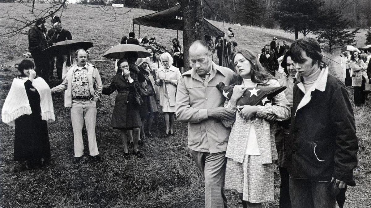 Madonna Griffith clung to the flag she was presented at the burial of her husband Robert, 24, a Vietnam veteran who died in the Scotia Mine disaster in Letcher County 40 years ago.