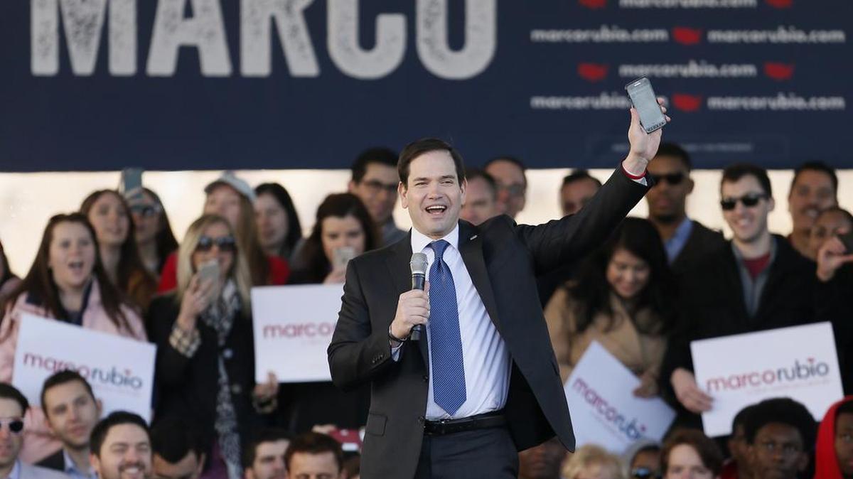 Republican presidential candidate Marco Rubio speaks a rally Friday in Dallas, where he read Donald Trump’s tweets off his cell phone.