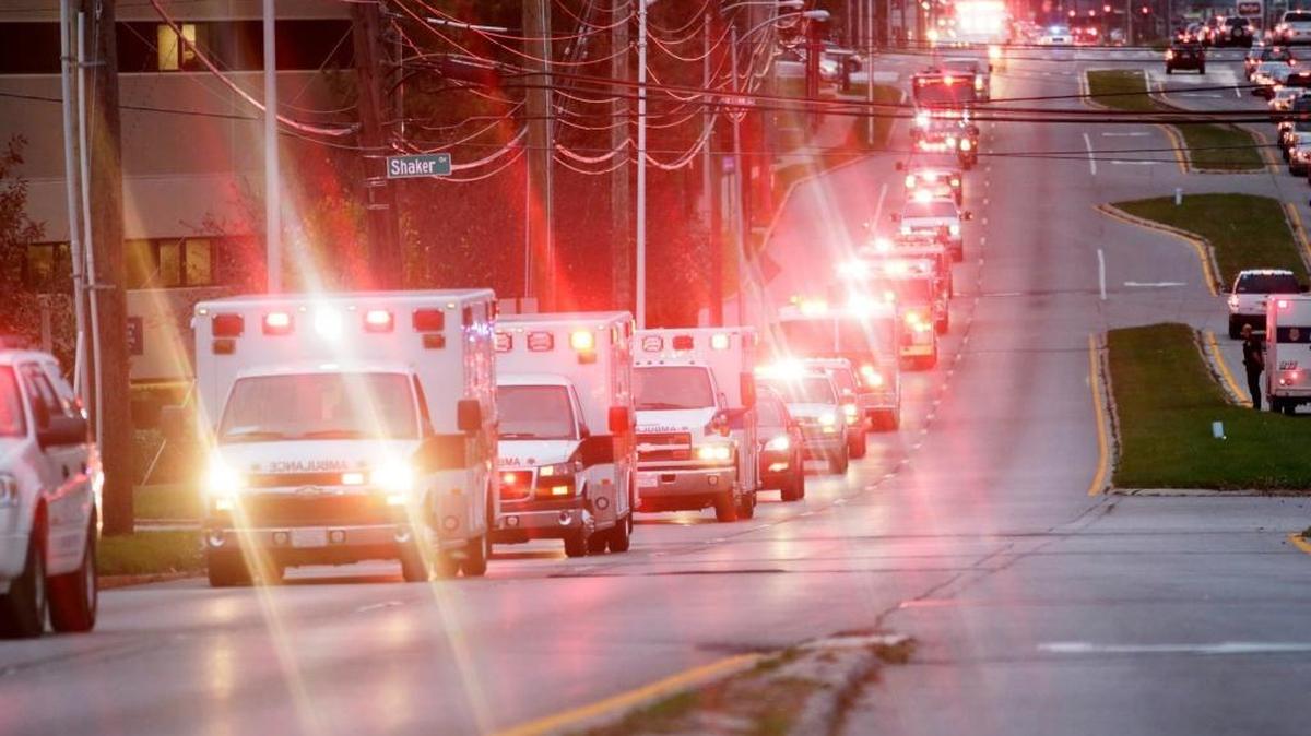 The body of Jessamine County paramedic John Mackey was escorted by dozens of emergency vehicles including several Jessamine County ambulances down Harrodsburg Road Lexington, Ky., on Nov. 9, 2015. Mackey was was hit by a car Thursday while responding to a call and died Monday morning. He was being taken back to Jessamine County.