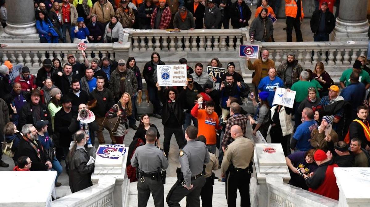 Union members gather in protest at the steps of the Kentucky State Senate in opposition of Kentucky House Bill 1, Saturday, Jan. 7, 2017, in Frankfort, Ky. (AP Photo/Timothy D. Easley)