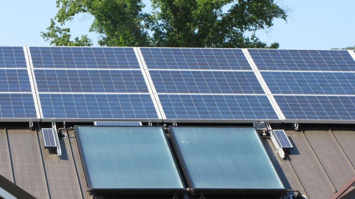 Solar panels on the roof of one of five houses built in Whitley County to demonstrate design and building standards aimed at cutting heating and cooling costs by 90 percent on May 24, 2012.