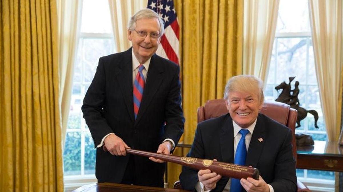 Kentucky’s Republican Sen. Mitch McConnell, the Senate majority leader, presented a Louisville slugger to Trump after Congress passed the GOP tax package. The sluggers are made by the company of the same name that started in that Kentucky city.