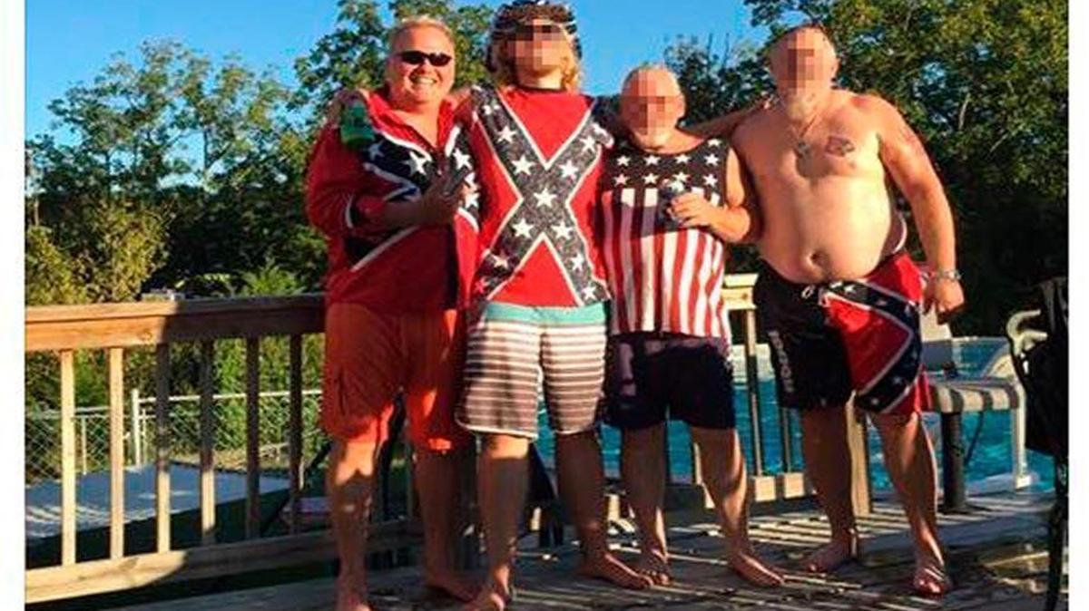 In this Facebook post, Dan Johnson, left, poses with friends wearing clothing with Confederate imagery.