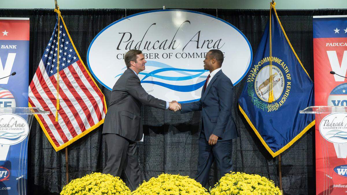 Democratic Gov. Andy Beshear, who is running for reelection, and Republican nominee and Kentucky Attorney General Daniel Cameron shake hands before the Paducah Area Chamber of Commerce’s Power in Partnership Luncheon and Gubernatorial Forum at the Paducah-McCracken County Convention Center in Paducah, Ky., on Thursday, Oct. 12, 2023.
