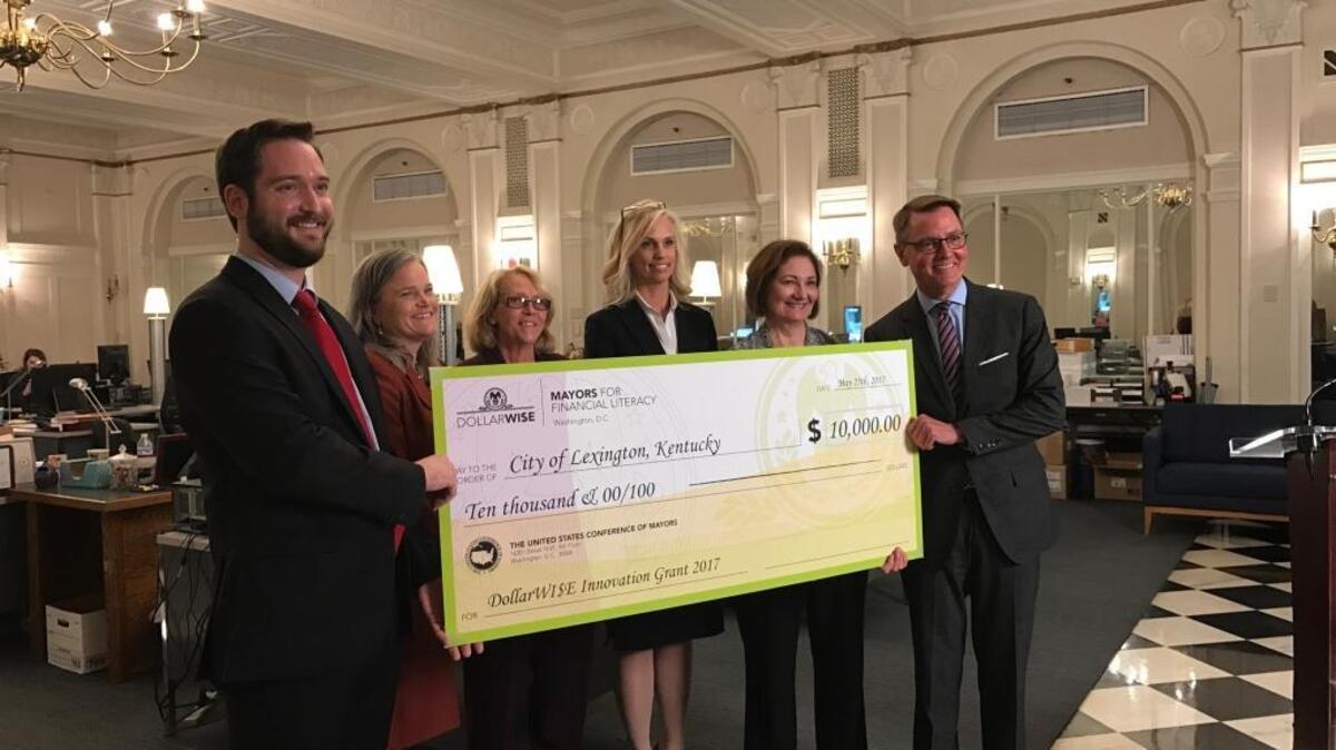 Lexington Mayor Jim Gray, far right, met with representatives of the U.S. Conference of Mayors, Merrill Lynch and GLOBAL LEX in the Urban County Government Center to accept a $10,000 grant from the U.S. Conference of Mayors on Thursday, May 25, 2017.