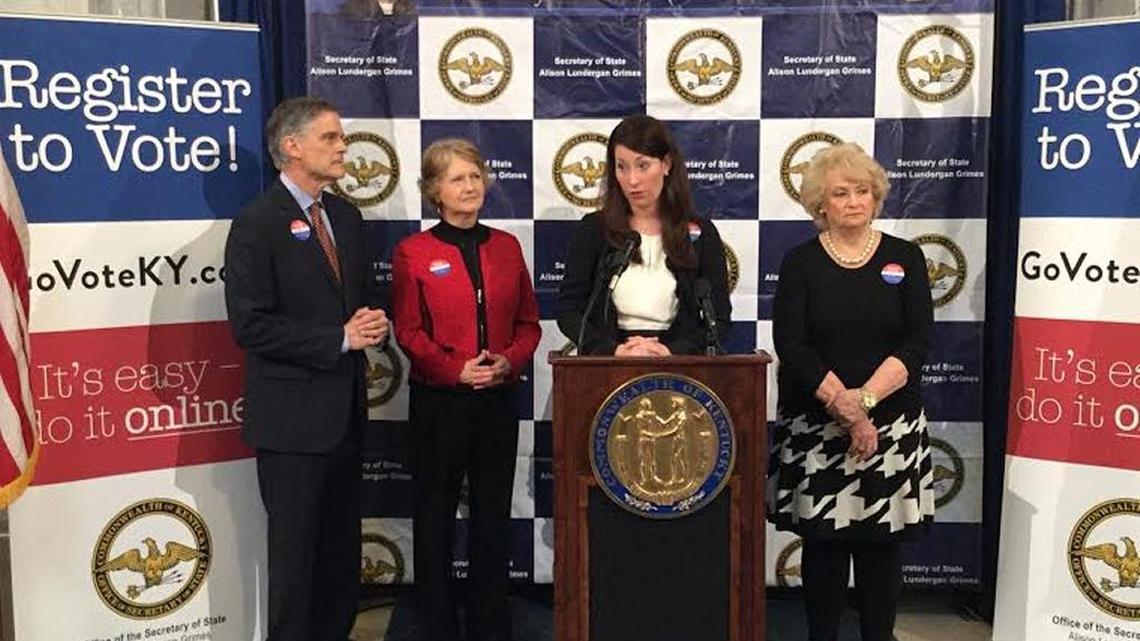 Secretary of State Alison Lundergan Grimes, at podium, announces online voter registration in Kentucky with former Secretaries of State Bob Babbage and Elaine Walker and Jefferson County Clerk Bobbie Holsclaw.