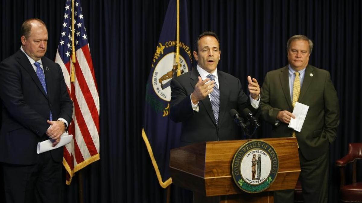 Kentucky Governor Matt Bevin, along with then-House Speaker Jeff Hoover (left) and Senate President Robert Stivers, unveils a plan to overhaul Kentucky’s public pension systems during a press conference at the Kentucky State Capital on Wednesday, October 18, 2017 in Frankfort, Ky.