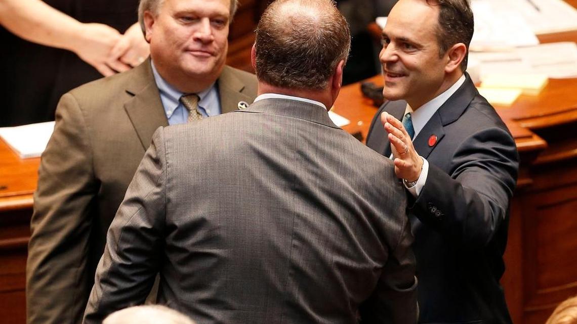 Senate President Robert Stivers, left, and Gov. Matt Bevin, right, talked with House Speaker Jeff Hoover, middle, in the House chambers in Frankfort, Ky., Tuesday, January 3, 2017.