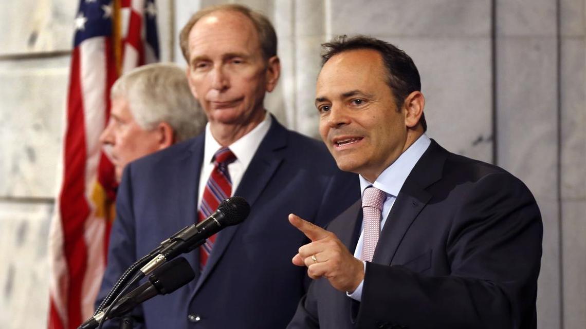 Gov. Matt Bevin, right, unveiled details of his plan to overhaul Medicaid at a news conference in the state Capitol rotunda on June 22. On the left is Mark D. Birdwhistell, who assembled a team of experts to assist in the drafting of a Medicaid waiver application.