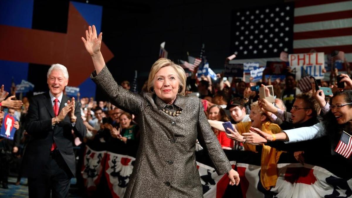 Hillary Clinton, accompanied by former President Bill Clinton walks to stage at her presidential primary election night rally in Philadelphia.