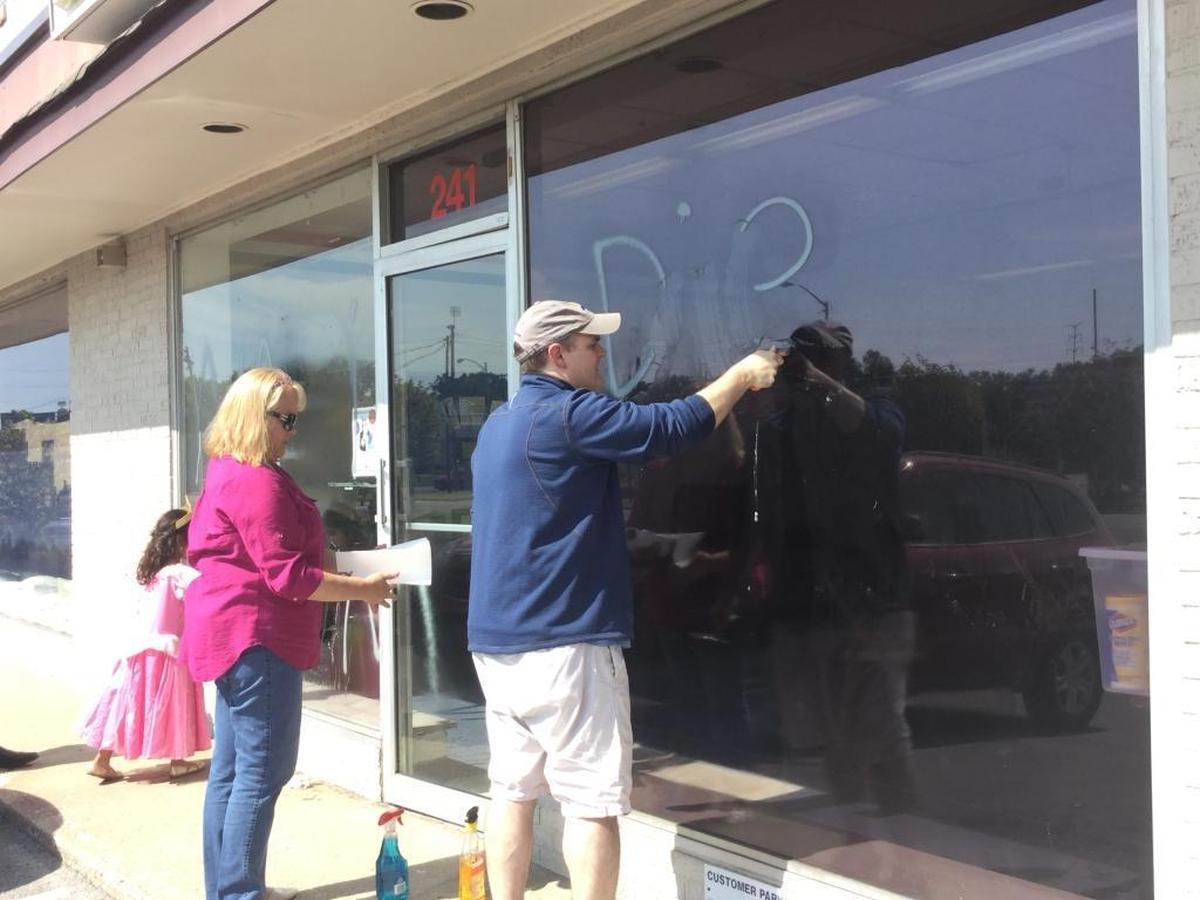 Gary McCollum, chairman of the Republican Party of Fayette County, cleaned paint off the windows at party headquarters on Saturday. Someone vandalized the office either late Friday or early Saturday.