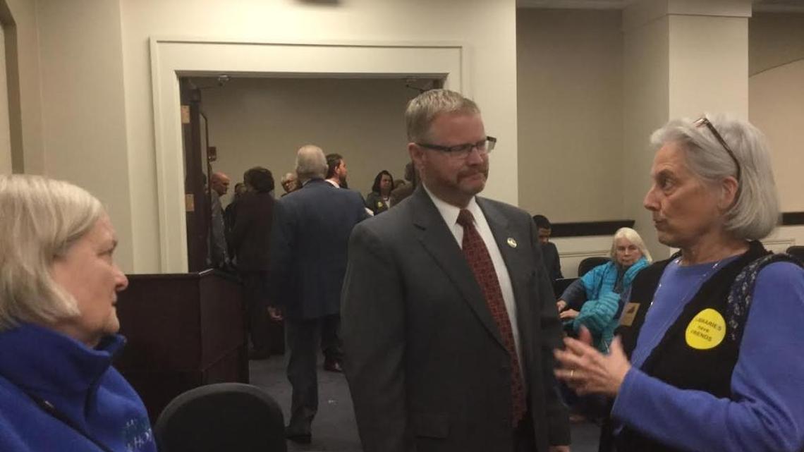 Retired Scott County librarians Nanette Eichell, left, and Earlene Arnett talk with state Sen. Damon Thayer, R-Georgetown, on Wednesday, Feb. 8, 2017. The women oppose Senate Bill 48, which would let county judge-executives name their own library board members.