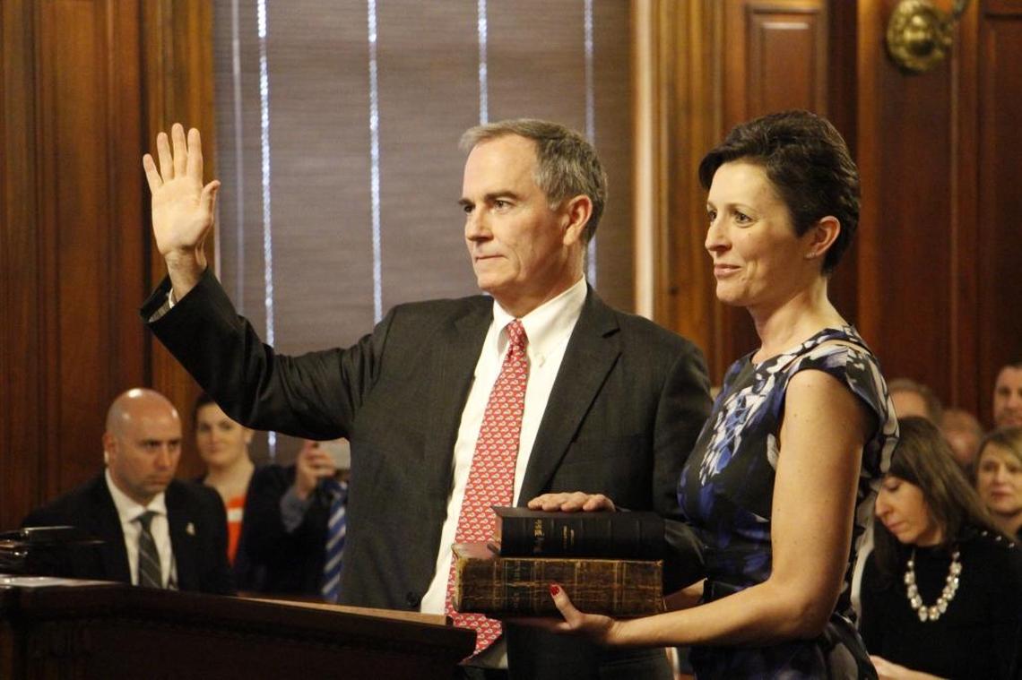 Laurance “Larry” VanMeter being ceremonially sworn in as a Kentucky Supreme Court justice. VanMeter’s significant other, Lucy Ferguson, held two family Bibles, one of which predates the Civil War.