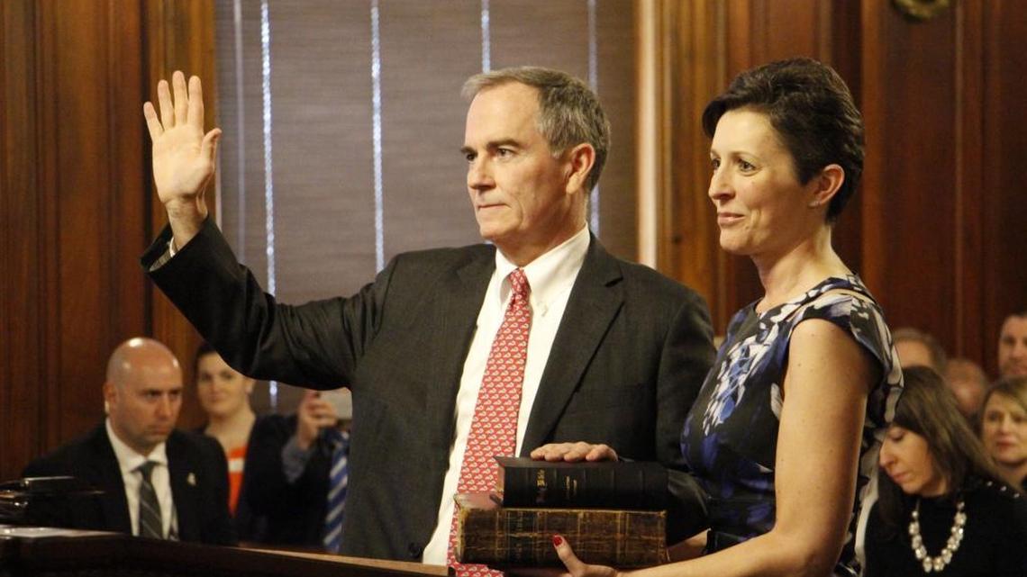 Laurance “Larry” VanMeter was ceremonially sworn in Tuesday as a Kentucky Supreme Court justice. VanMeter’s significant other, Lucy Ferguson, held two family Bibles, one of which predates the Civil War.