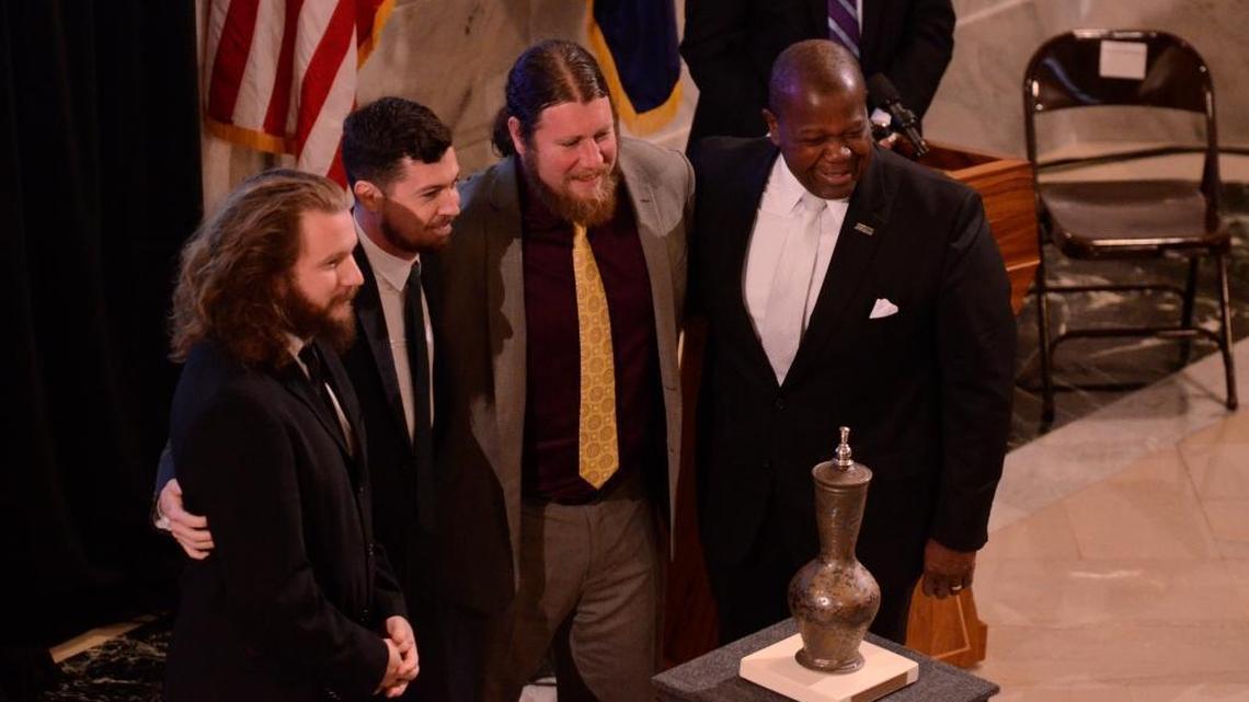 My Morning Jacket members Jim James, Tom Blankenship and Patrick Hallahan accept the national award with Kentucky Arts Council vice-chair Everett McCorvey. The 2014 Governor's Awards in the Arts, an annual event presented by the Kentucky Arts Council, were Oct. 9, 2014, in the Rotunda of the Kentucky State Capitol Building in Frankfort, Ky.