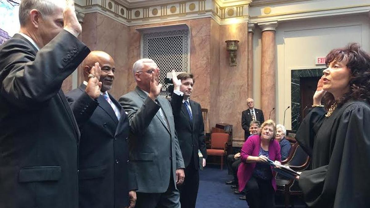 Supreme Court Justice Michelle Keller swears in new House members: Lew Nicholls, left, Jeffrey Taylor, Chuck Tackett and Daniel Elliott.