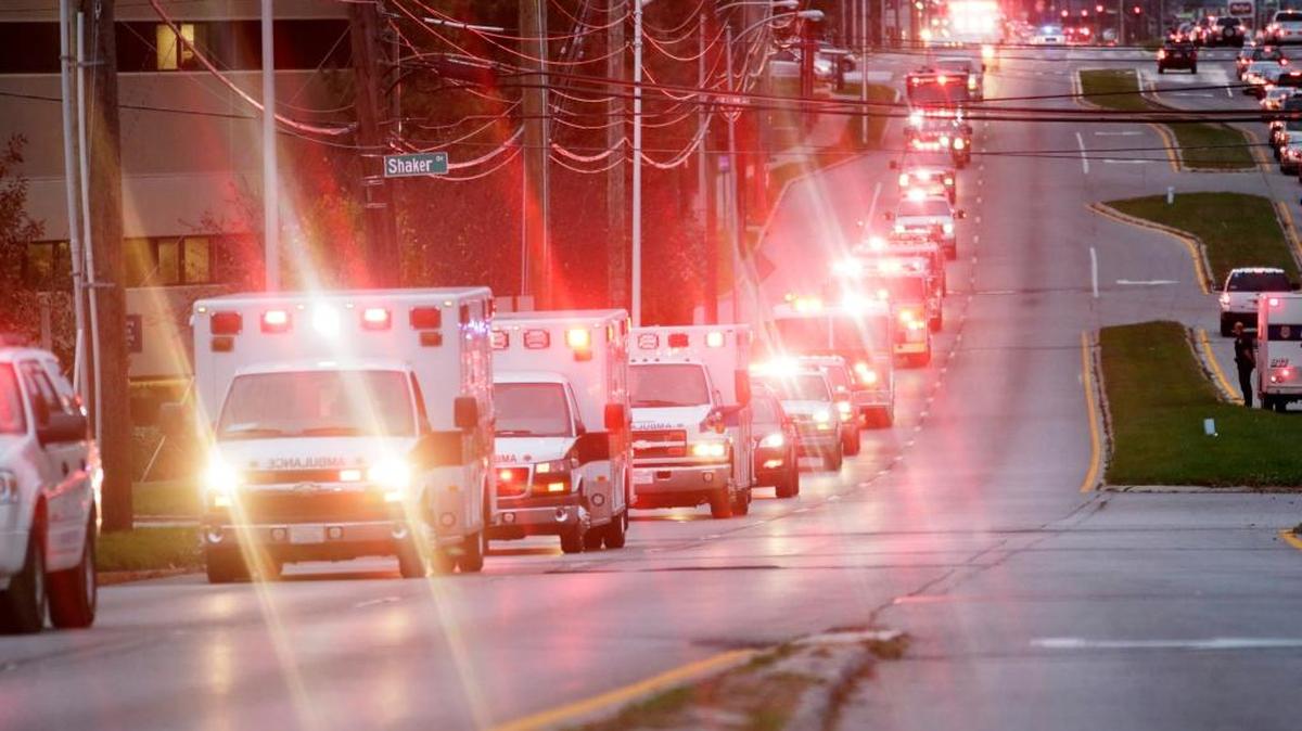 The body of Jessamine County paramedic John Mackey was escorted by dozens of emergency vehicles including several Jessamine County ambulances down Harrodsburg Road in Lexington on Nov. 9, 2015. Mackey died after being hit by a car while responding to a call.