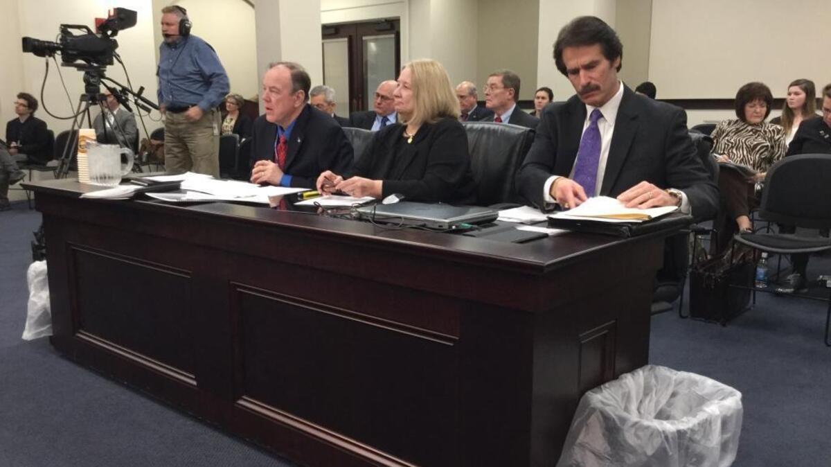 Fayette County Judge-Executive John Roberts, left, and Democratic state Rep. Ruth Ann Palumbo and Republican Rep. Stan Lee, both of Lexington, told a House committee Monday why Roberts’ office should be abolished.