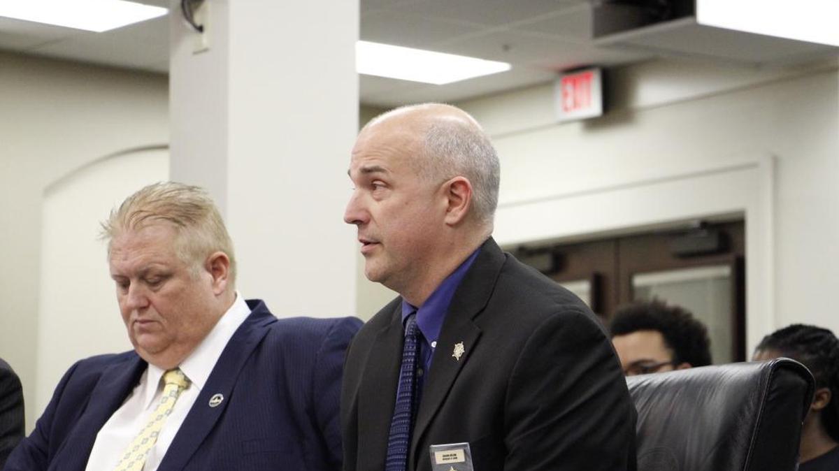 Shawn Helbig, a member of the board of the Kentucky Fraternal Order of Police, testified Wednesday in support of a bill that would make police officers, firefighters and EMS workers a protected class under Kentucky’s hate-crime law. Rep. Kevin Bratcher, R-Louisville, right, sponsored the bill.