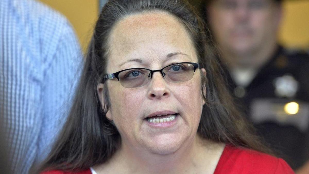 In this Sept. 14, 2015 photo, Rowan County Clerk Kim Davis makes a statement to the media at the front door of the Rowan County Judicial Center in Morehead, Ky. Last summer, Davis refused to issue marriage licenses to gay couples.