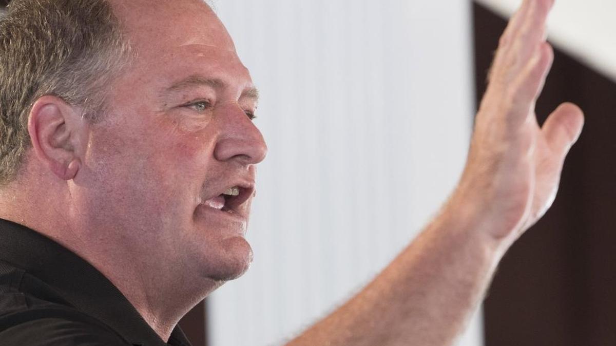 Kentucky House Speaker Jeff Hoover waves to the crowd during the political speeches at the Fancy Farm picnic on Saturday Aug. 5, 2017, in Fancy Farm, Ky.